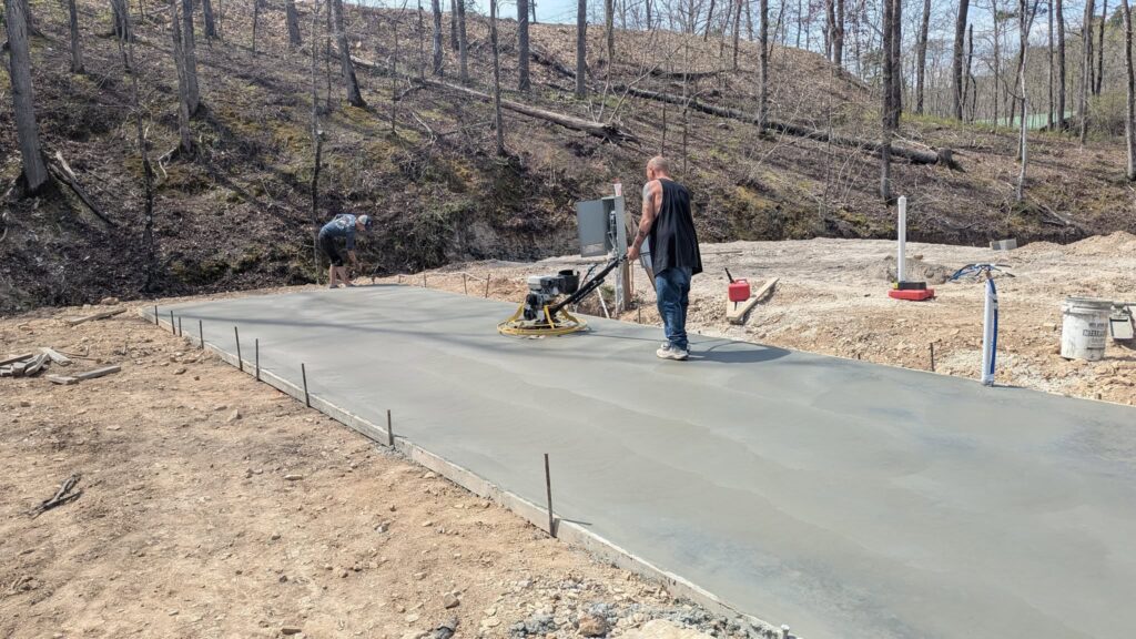 A & P Concrete crew power-troweling a fresh slab